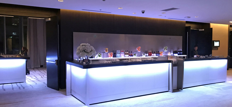 Hotel bar with white lighting and back buffet